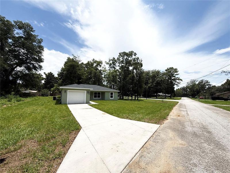 Front exterior of a new home in , Ocala, FL, highlighting curb appeal (Image 21). Front exterior of a new home in , Ocala, FL, highlighting curb appeal (Image 21).