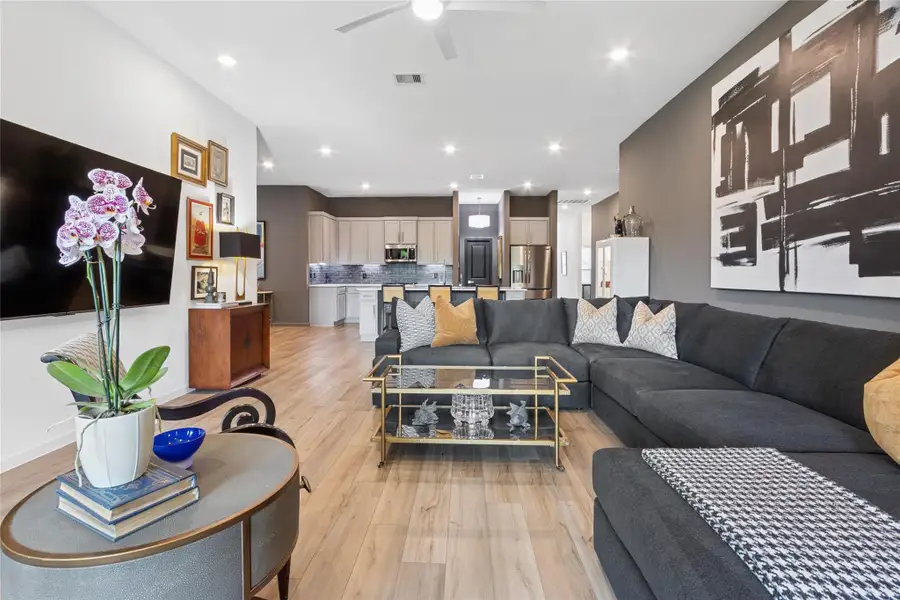 View from the rear towards the kitchen with recessed lighting throughout