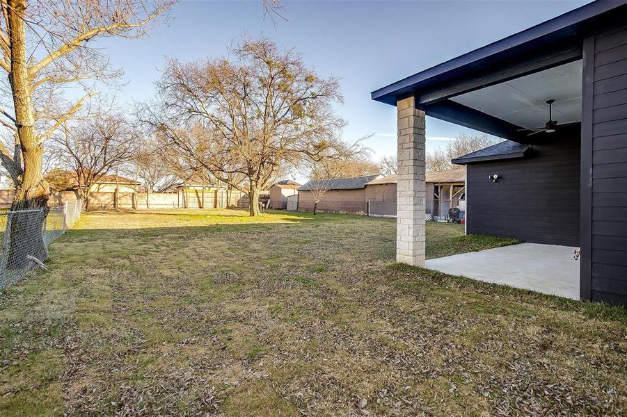 View of yard with a patio and ceiling fan