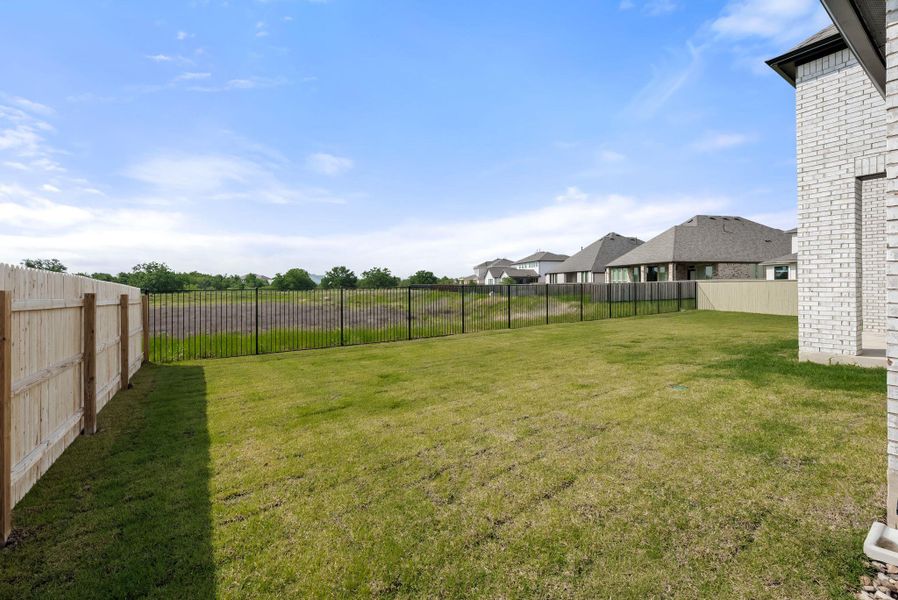 Exterior details and patio area of a home in Santa Rita Ranch, Liberty Hill (Image 23).