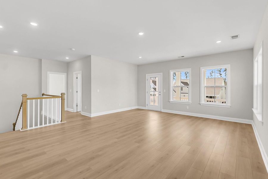 Spacious, unfurnished interior of a new home in Tidewater at Lakes of Cane Bay, Summerville (Image 40).