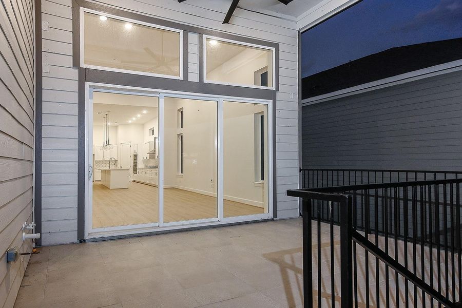 Exterior details and patio area of a home in Lake Breeze, Willis (Image 3).