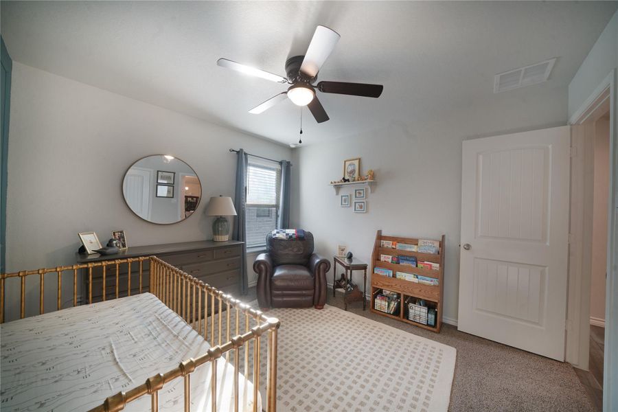 Bedroom featuring carpet and ceiling fan