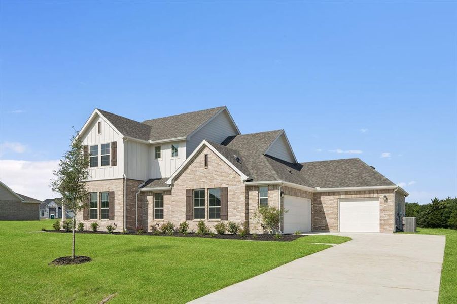View of front of property featuring a shingled roof, a front yard, and board and batten siding View of front of property featuring a shingled roof, a front yard, and board and batten siding