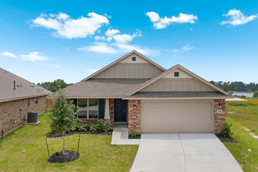 Front exterior of a new home in Bayou Maison, Texas City, TX, highlighting curb appeal (Image 1). Front exterior of a new home in Bayou Maison, Texas City, TX, highlighting curb appeal (Image 1).