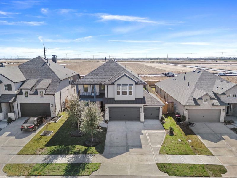 Front exterior of a new home in , Fulshear, TX, highlighting curb appeal (Image 21). Front exterior of a new home in , Fulshear, TX, highlighting curb appeal (Image 21).