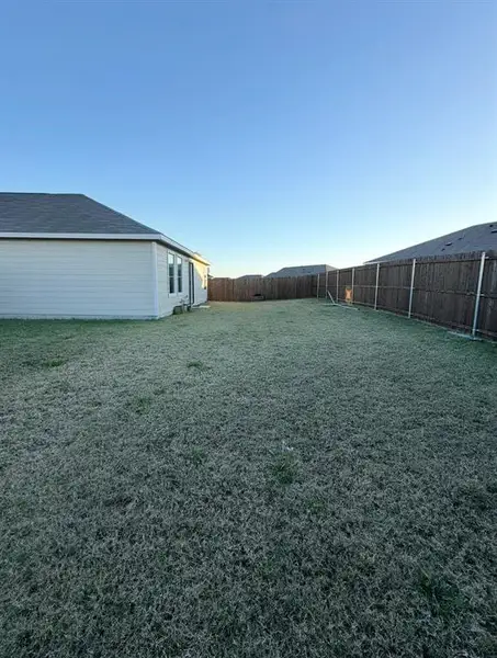 View of fenced backyard