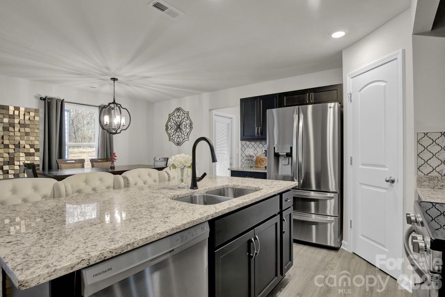 Kitchen - double sink, dishwasher, electric range