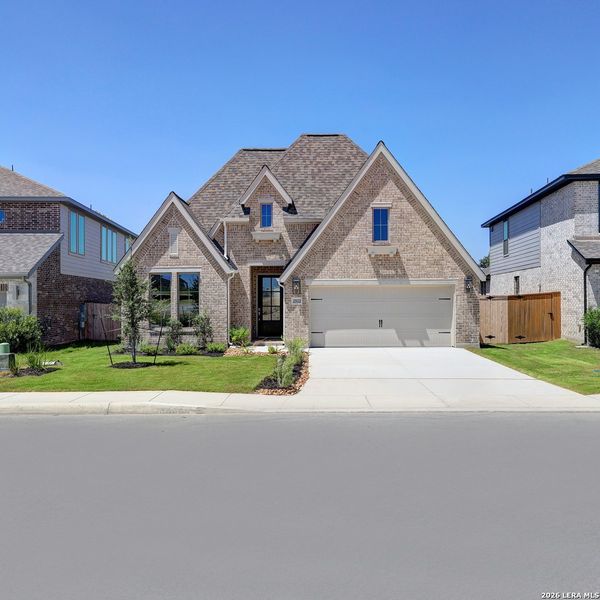 Front exterior of a new home in Ladera, San Antonio, TX, highlighting curb appeal (Image 2).