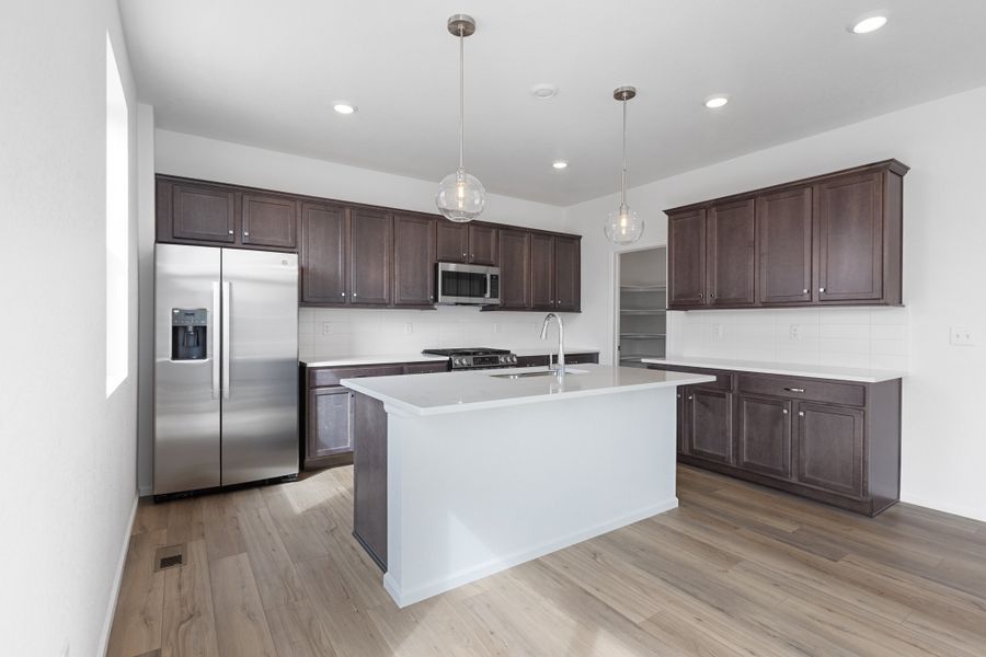 Furnished interior view inside a new home in The Cottages Collection at Ridgeline Vista, Brighton (Image 4).