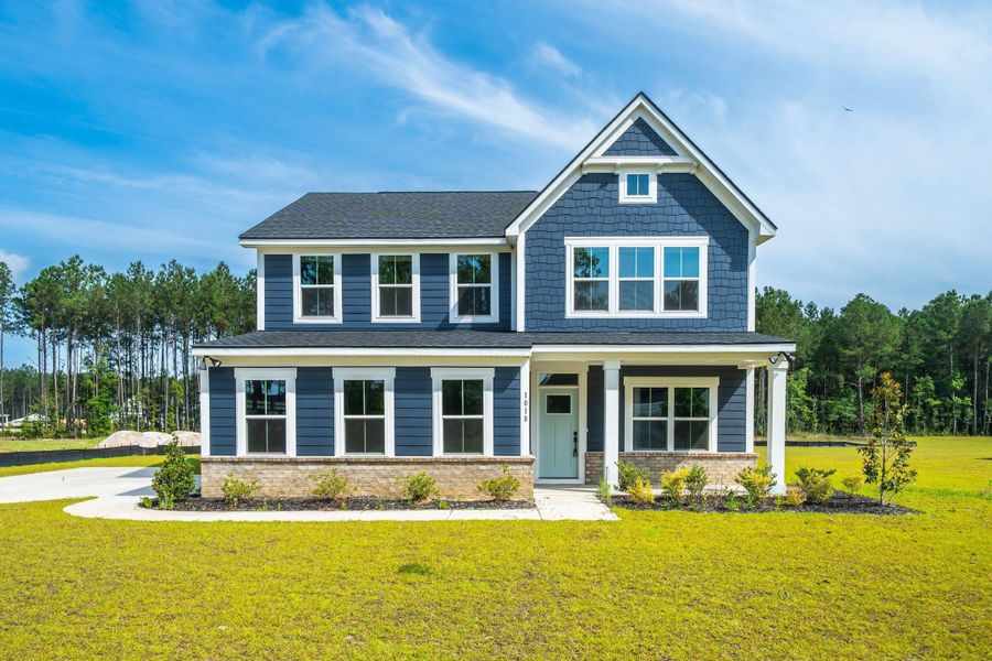 Front exterior of a new home in , Ridgeville, SC, highlighting curb appeal (Image 1). Front exterior of a new home in , Ridgeville, SC, highlighting curb appeal (Image 1).