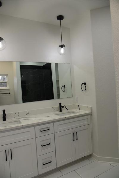 Bathroom with vanity and tile patterned floors