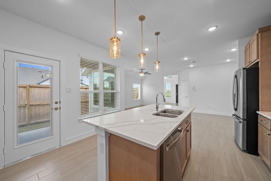Furnished interior view inside a new home in Meridiana, Iowa Colony (Image 7).