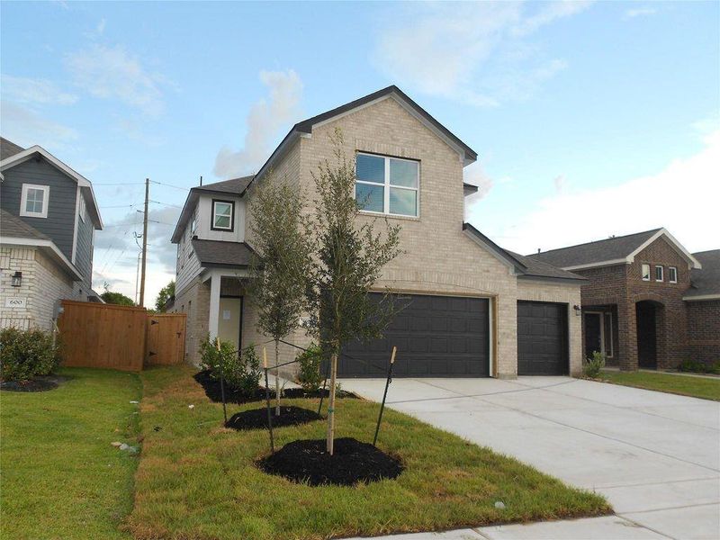 Front exterior of a new home in , Dayton, TX, highlighting curb appeal (Image 21).