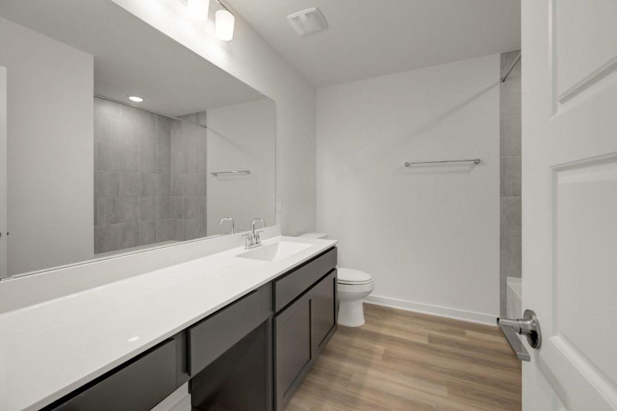 Furnished interior view inside a new home in Lone Star Landing, Montgomery (Image 9).