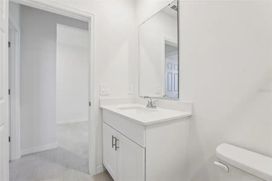 Furnished interior view inside a new home in Lake Deer Estates - Signature Series, Poinciana (Image 5).