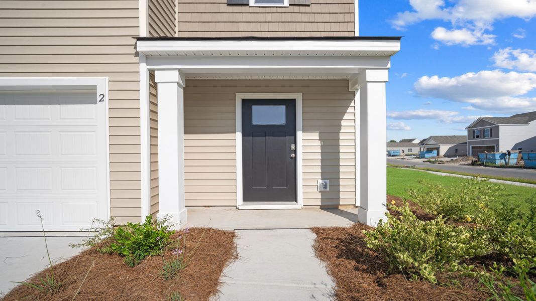 Front exterior of a new home in Rice Hope, Port Wentworth, GA, highlighting curb appeal (Image 2).