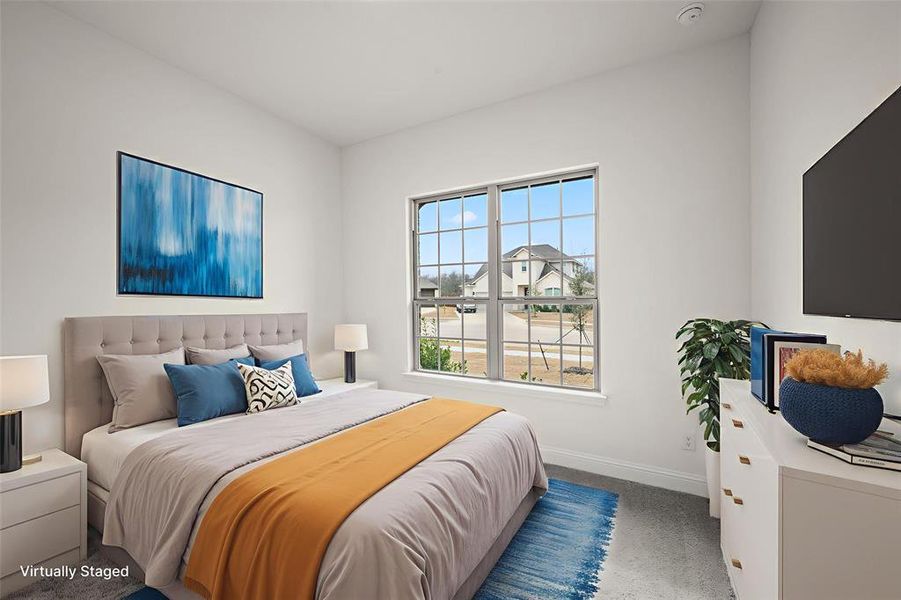 Carpeted bedroom with baseboards Carpeted bedroom with baseboards