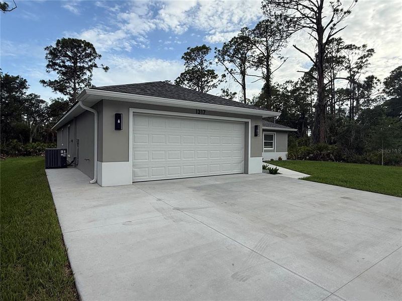 Front exterior of a new home in , Port Charlotte, FL, highlighting curb appeal (Image 18).