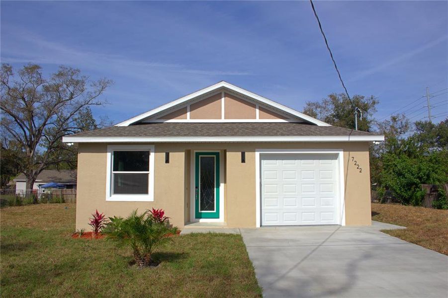 Front exterior of a new home in , Tampa, FL, highlighting curb appeal (Image 18).