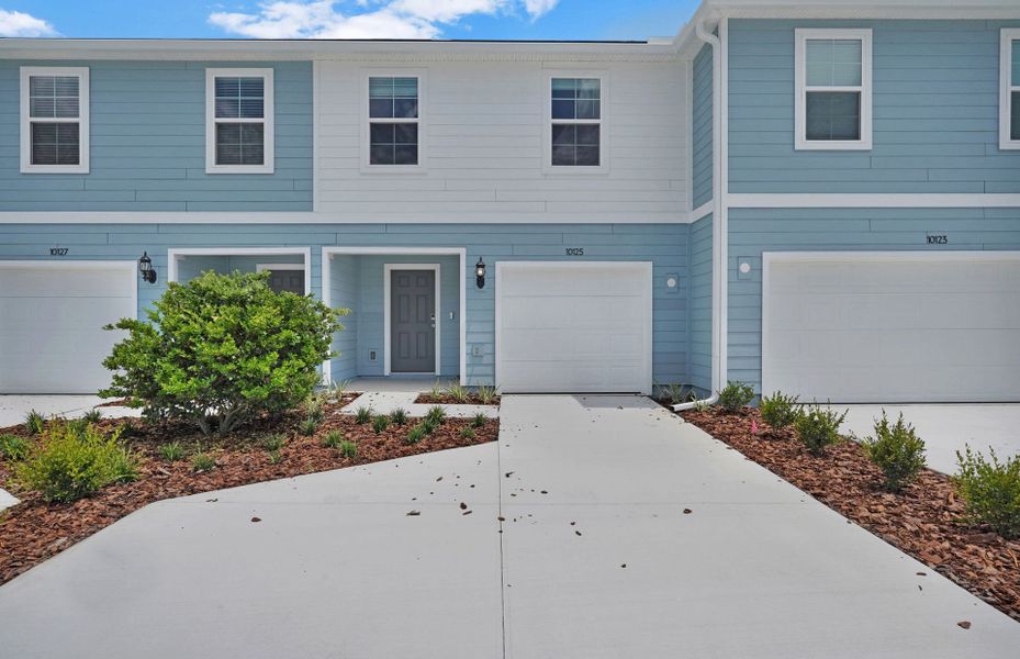 Front exterior of a new home in Normandy Pines, Jacksonville, FL, highlighting curb appeal (Image 1). Front exterior of a new home in Normandy Pines, Jacksonville, FL, highlighting curb appeal (Image 1).