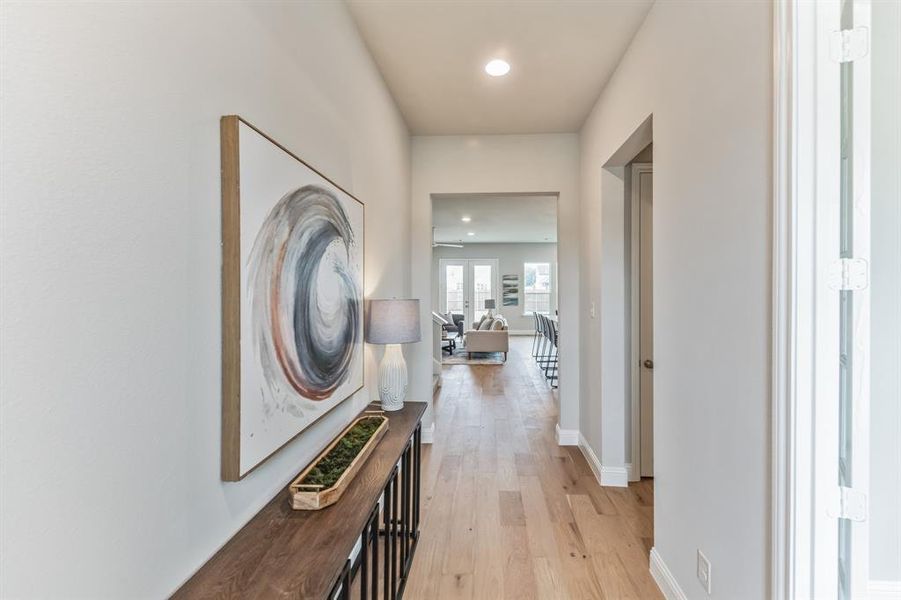 Corridor featuring light hardwood / wood-style floors