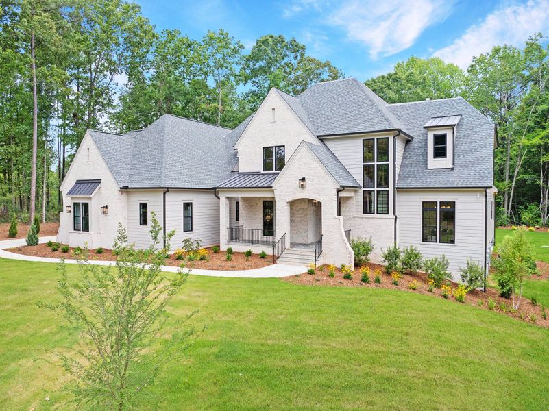 Front exterior of a new home in Corbett Landing, Pittsboro, NC, highlighting curb appeal (Image 6). Front exterior of a new home in Corbett Landing, Pittsboro, NC, highlighting curb appeal (Image 6).