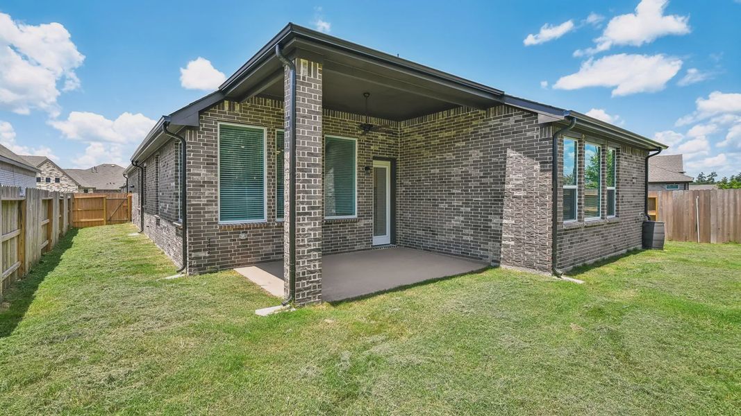 Exterior details and patio area of a home in Artavia, Conroe (Image 3).