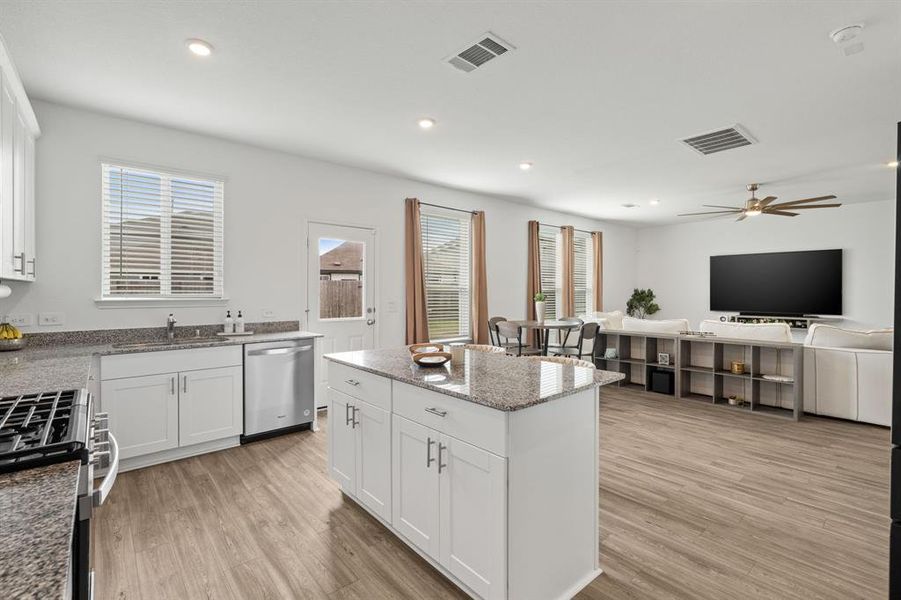 Entertain with ease in the open concept Gourmet Kitchen with stunning Stainless Steel appliances!