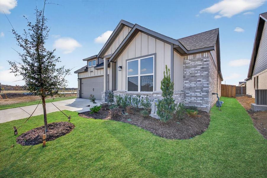 Front exterior of a new home in Hickory Hill, Sherman, TX, highlighting curb appeal (Image 19).