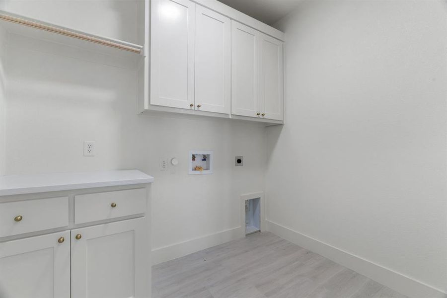 Mudroom with light wood finished floors