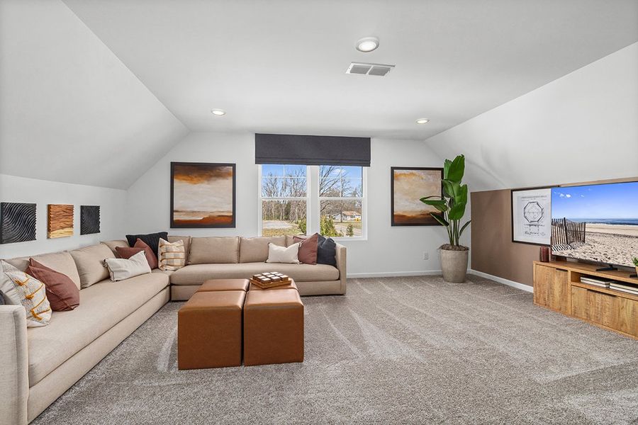 A living room with a couch and a table.