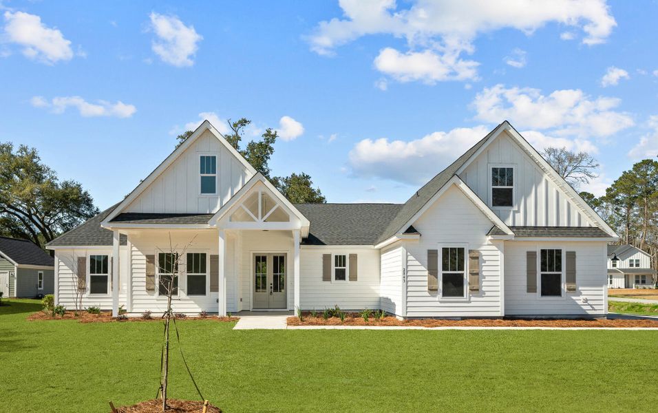 Front exterior of a new home in , Johns Island, SC, highlighting curb appeal (Image 1).
