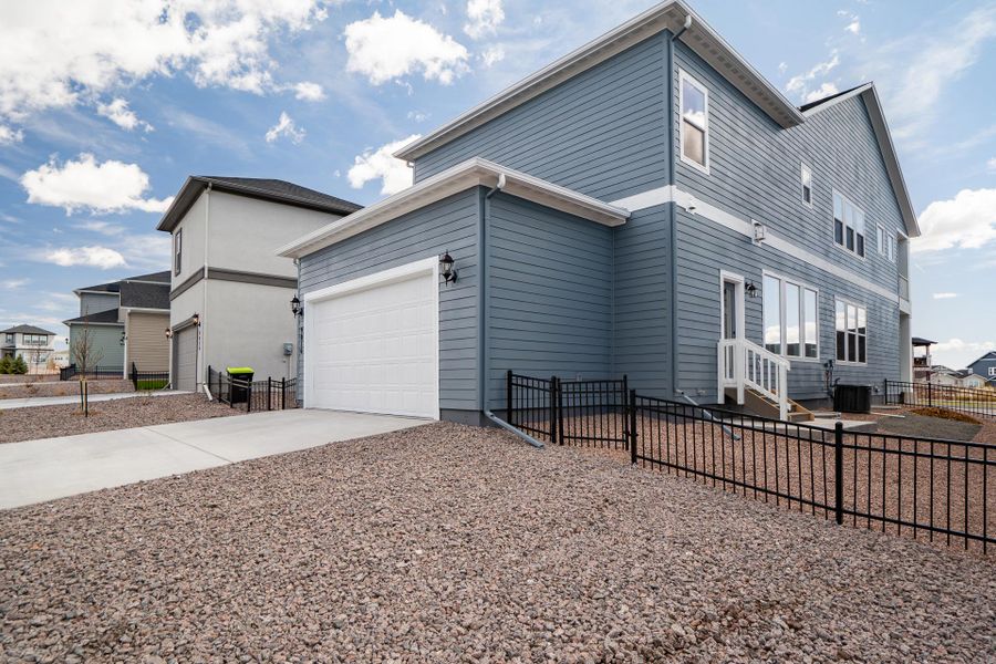 Representative exterior photo of a completed home built from the The Thornberry by David Weekley Homes in Revel Crossing at Wolf Ranch – The Outlook Collection, Colorado Springs, CO (Image 1).