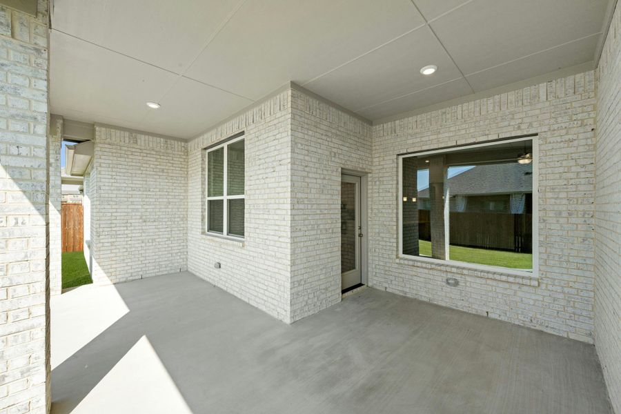 Front exterior of a new home in Kentsdale Farms, DeSoto, TX, highlighting curb appeal (Image 15).