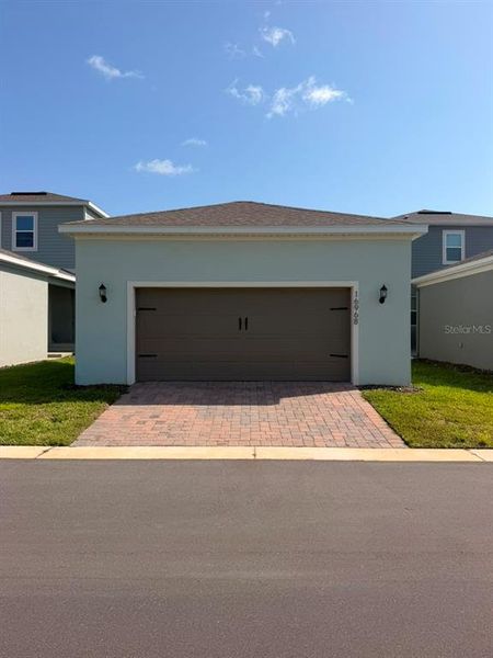 Front exterior of a new home in , Winter Garden, FL, highlighting curb appeal (Image 24).