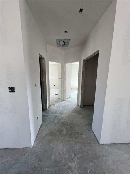 Corridor featuring concrete floors
