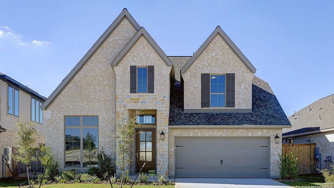 Front exterior of a new home in Ladera 50', San Antonio, TX, highlighting curb appeal (Image 24).