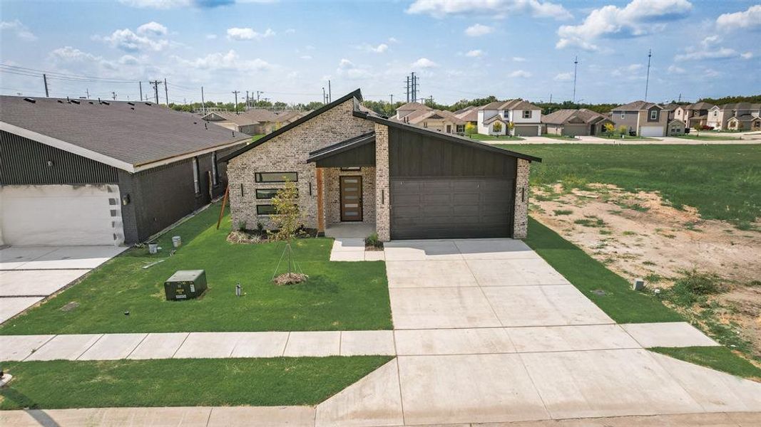 Front exterior of a new home in , Greenville, TX, highlighting curb appeal (Image 17). Front exterior of a new home in , Greenville, TX, highlighting curb appeal (Image 17).
