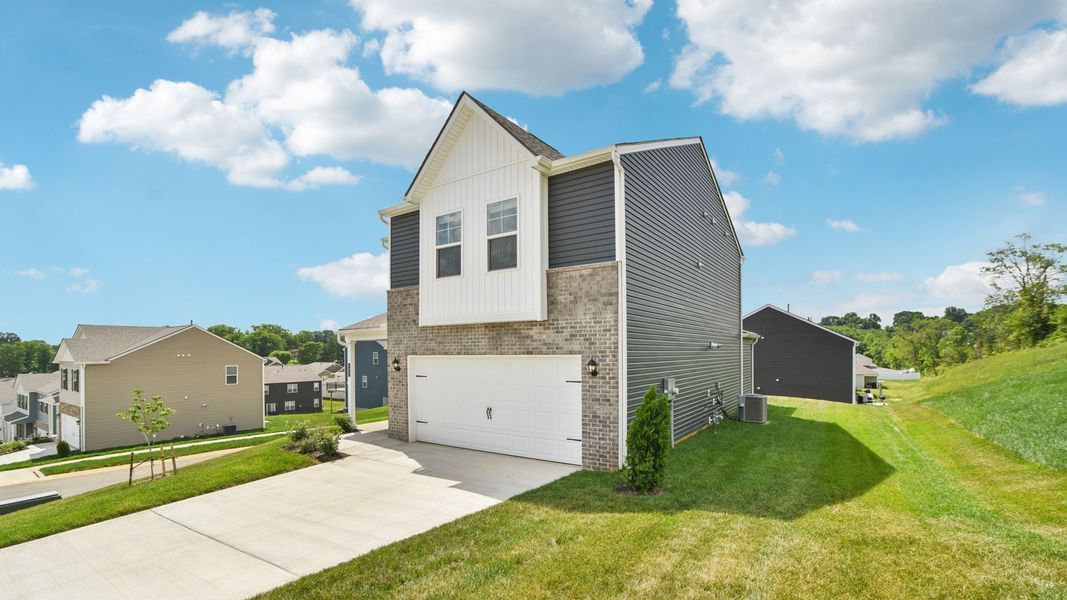 Representative exterior photo of a completed home built from the Craig by D.R. Horton in The Hideaway at Fox Meadows, Bluff City, TN (Image 2).