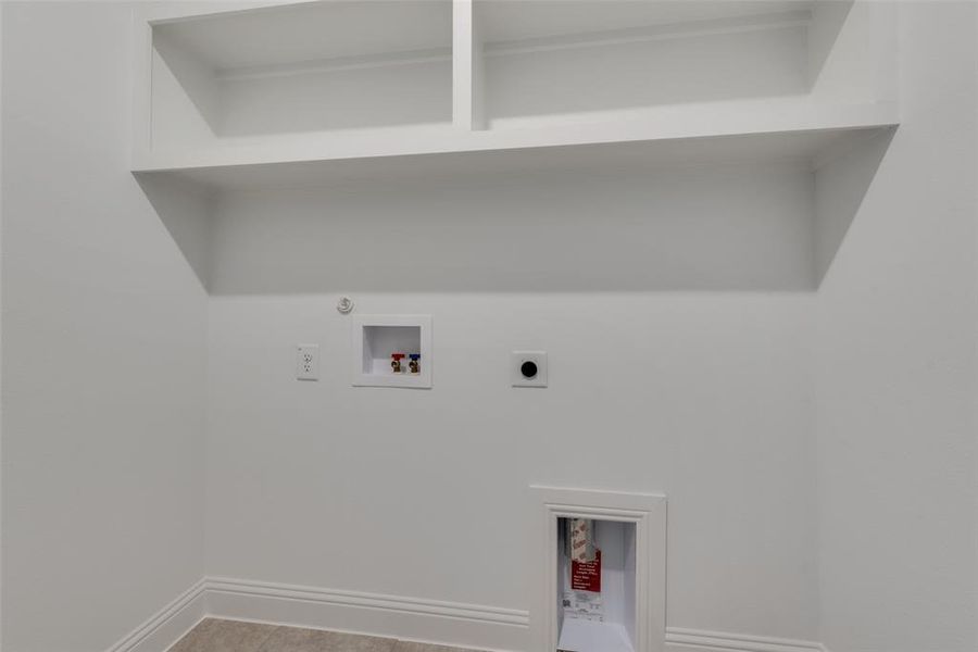 Laundry room featuring tile floors, gas dryer hookup, washer hookup, and hookup for an electric dryer