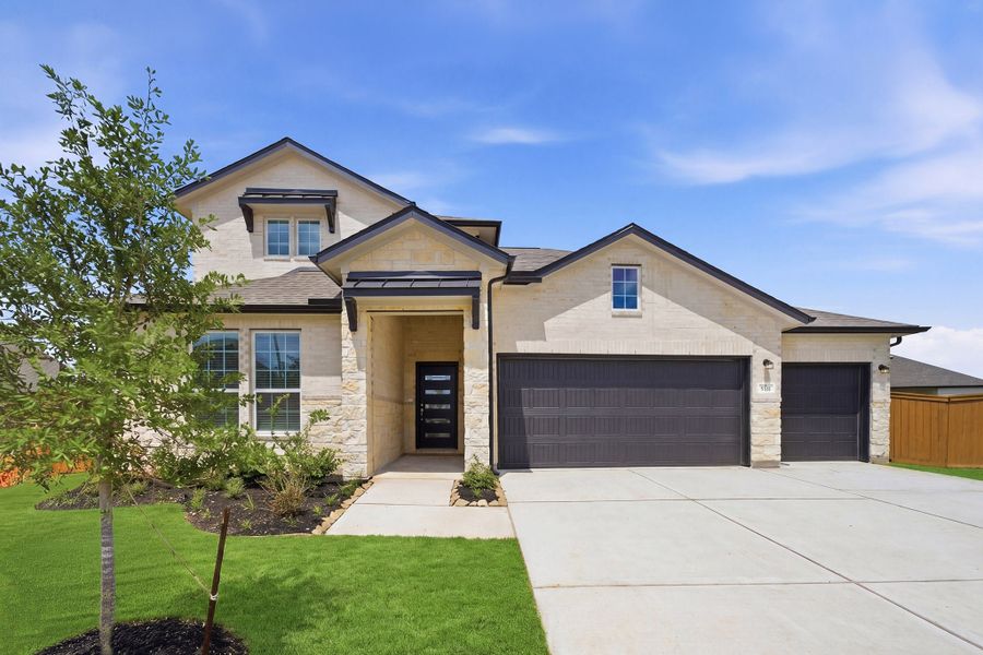 Front exterior of a new home in Sunterra, Katy, TX, highlighting curb appeal (Image 1). Front exterior of a new home in Sunterra, Katy, TX, highlighting curb appeal (Image 1).