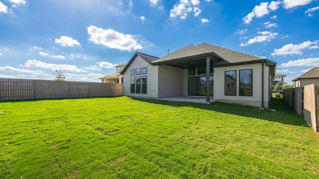 Back of property featuring a patio, a fenced backyard, and roof with shingles Back of property featuring a patio, a fenced backyard, and roof with shingles