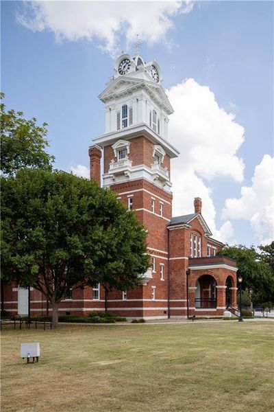 Front exterior of a new home in Rhodes Glen, Lawrenceville, GA, highlighting curb appeal (Image 31).