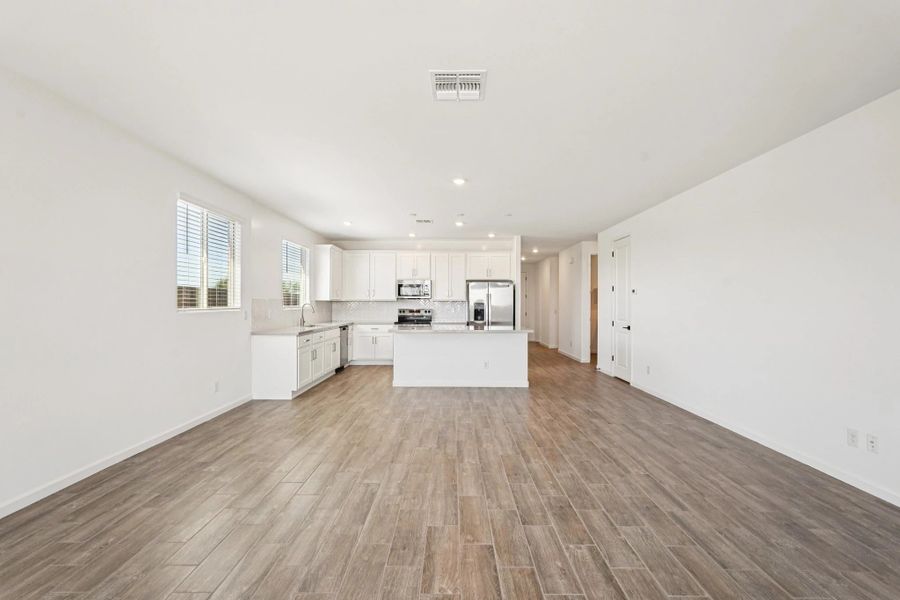 Great room, dining and kitchen Great room, dining and kitchen