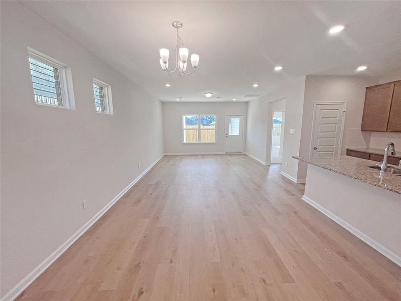 The Robin II- Dining Area into Family Room. Sample image to be used for example only, colors, options and upgrades vary.