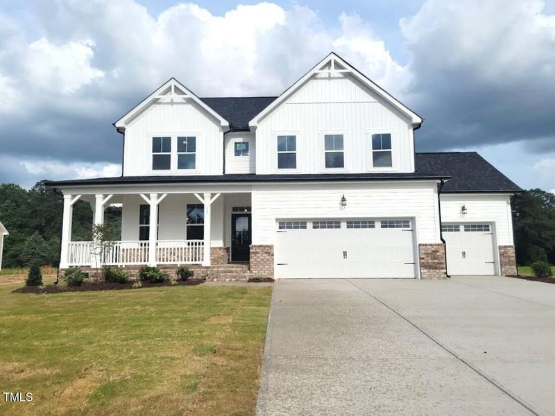 Front exterior of a new home in Tobacco Road, Angier, NC, highlighting curb appeal (Image 82). Front exterior of a new home in Tobacco Road, Angier, NC, highlighting curb appeal (Image 82).