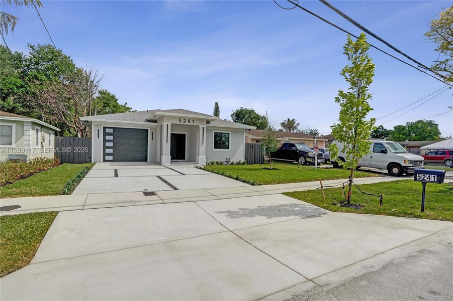 Front exterior of a new home in , West Park, FL, highlighting curb appeal (Image 29).