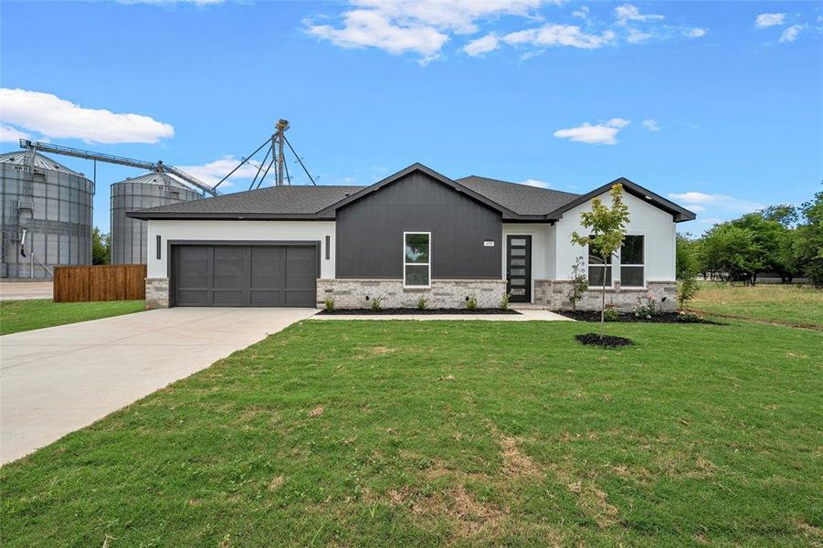 Front exterior of a new home in , Hillsboro, TX, highlighting curb appeal (Image 24).