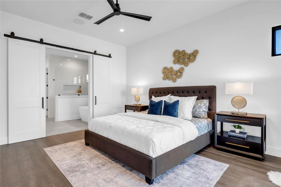 Bedroom featuring wood finished floors, recessed lighting, ensuite bathroom, and ceiling fan